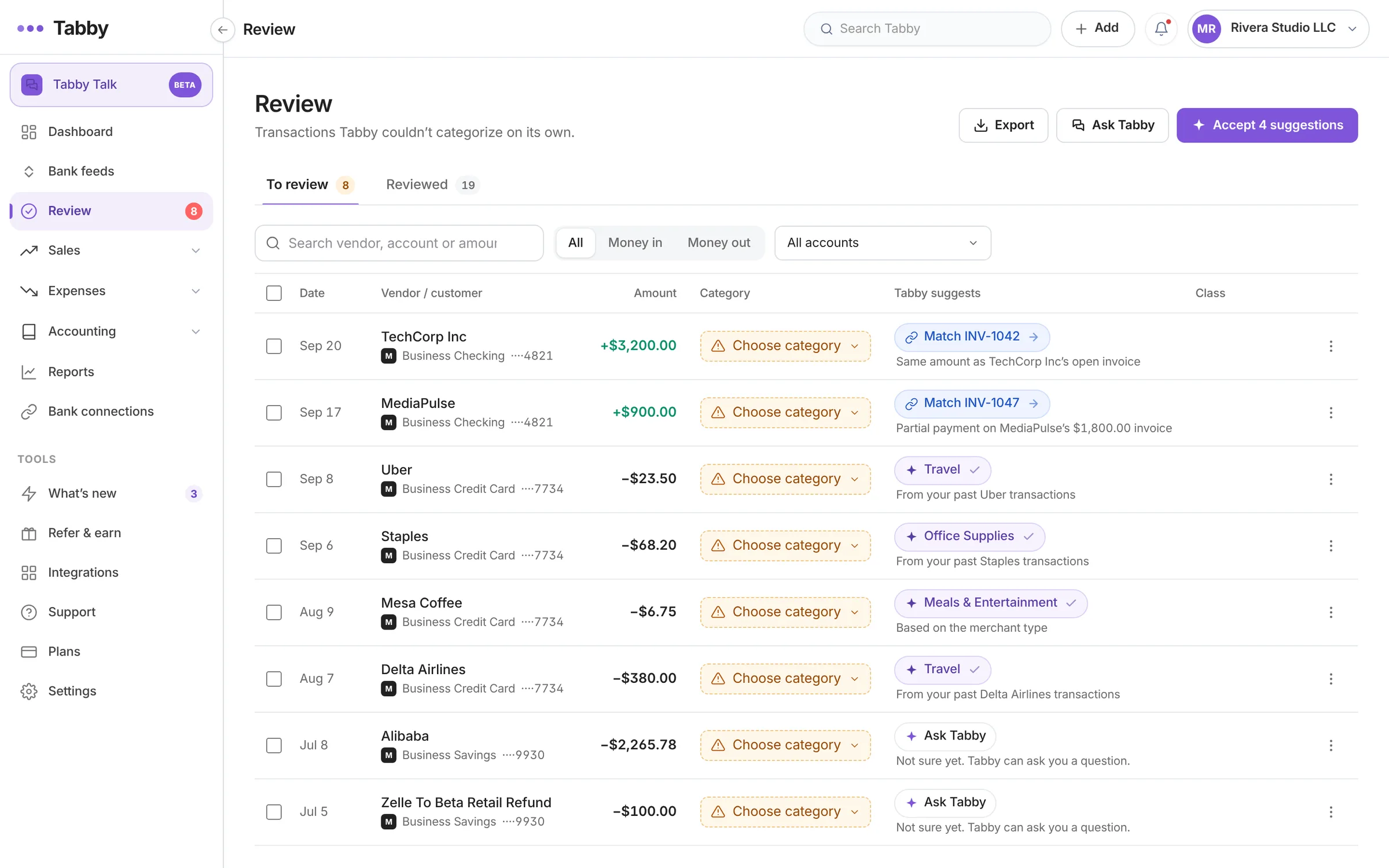 Tabby review list with suggested categories and invoice matches for uncategorized transactions